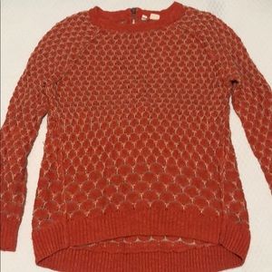 Orange sweater with tan stitching